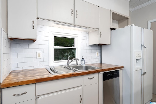 1800 2nd Ave S, Irondale, AL 35210 - kitchen featuring butcher block counters, dishwasher, white fridge with ice dispenser, open shelves, and decorative backsplash