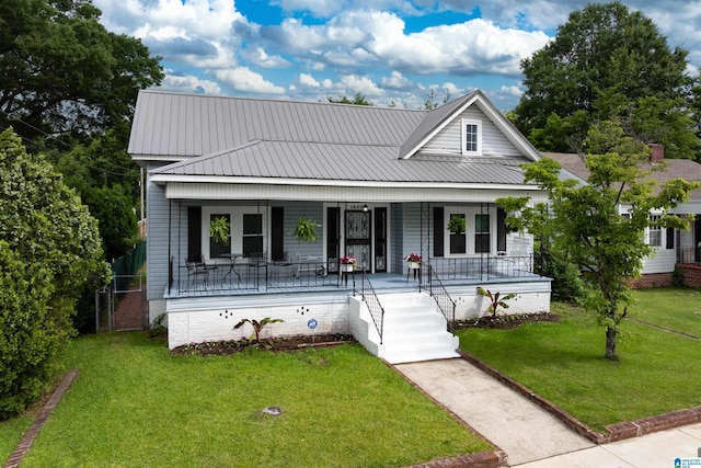1800 2nd Ave S, Irondale, AL 35210 - view of front of property with a porch, a front lawn, and metal roof