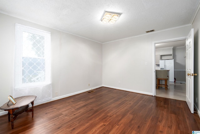1800 2nd Ave S, Irondale, AL 35210 - unfurnished room featuring dark wood finished floors, a textured ceiling, crown molding, and baseboards
