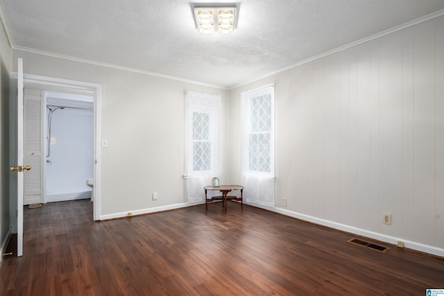 1800 2nd Ave S, Irondale, AL 35210 - spare room with dark wood-style flooring, a textured ceiling, baseboards, and crown molding