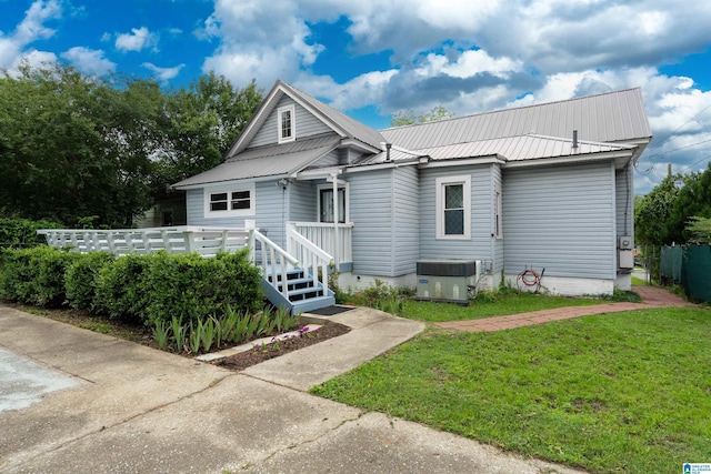 1800 2nd Ave S, Irondale, AL 35210 - bungalow with central air condition unit, a front lawn, and metal roof