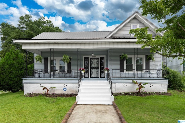 1800 2nd Ave S, Irondale, AL 35210 - view of front of property featuring a front yard, a porch, and metal roof