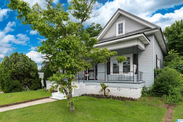 1800 2nd Ave S, Irondale, AL 35210 - view of front of house featuring covered porch and a front lawn