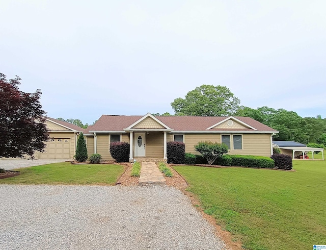 335 Shady Hollow Ln, Talladega, AL 35160 - ranch-style home featuring a front lawn, a garage, and driveway