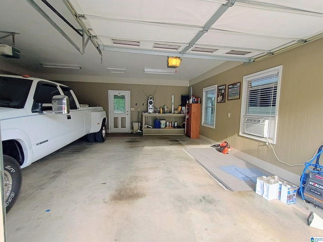 335 Shady Hollow Ln, Talladega, AL 35160 - garage featuring a garage door opener and cooling unit