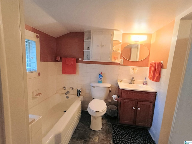 335 Shady Hollow Ln, Talladega, AL 35160 - full bath with toilet, a bath, vanity, vaulted ceiling, and tile walls