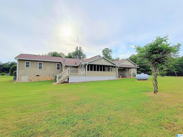 335 Shady Hollow Ln, Talladega, AL 35160 - rear view of property with a lawn, crawl space, a sunroom, and stairs