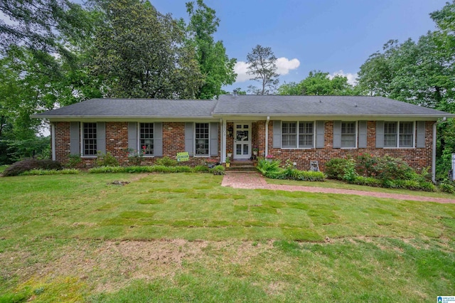 3309 Eaton Rd, Mountain Brook, AL 35223 - single story home with brick siding and a front lawn