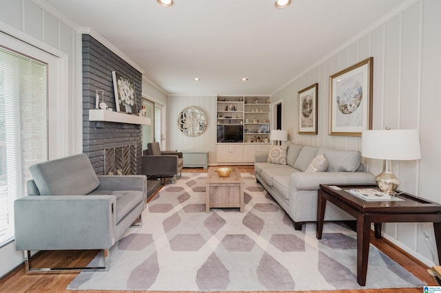 3309 Eaton Rd, Mountain Brook, AL 35223 - living room featuring ornamental molding, a brick fireplace, light wood-type flooring, and recessed lighting