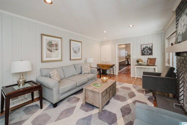 3309 Eaton Rd, Mountain Brook, AL 35223 - living room featuring wood finished floors, ornamental molding, a brick fireplace, and recessed lighting