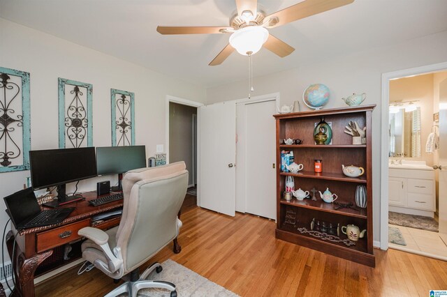 3309 Eaton Rd, Mountain Brook, AL 35223 - home office with a ceiling fan, light wood-style floors, and a sink