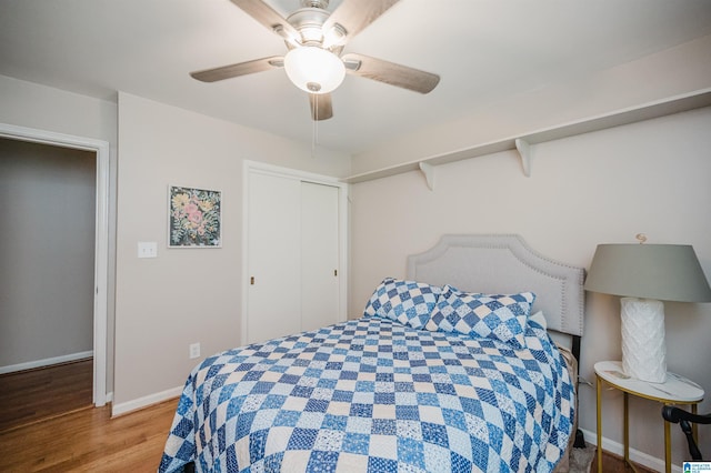 3309 Eaton Rd, Mountain Brook, AL 35223 - bedroom featuring wood finished floors, baseboards, a closet, and a ceiling fan