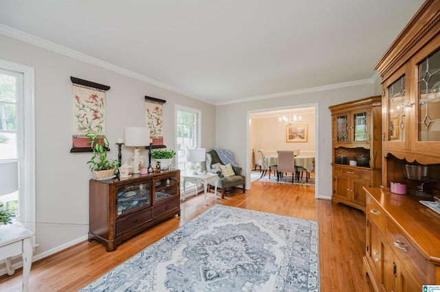 3309 Eaton Rd, Mountain Brook, AL 35223 - sitting room with ornamental molding, a chandelier, light wood-style flooring, and baseboards
