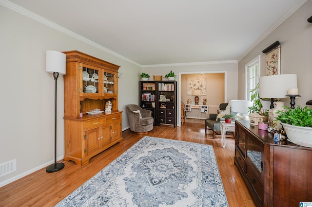 3309 Eaton Rd, Mountain Brook, AL 35223 - sitting room featuring crown molding, light wood-type flooring, and baseboards
