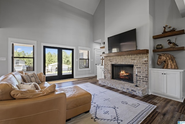 185 Meadowbrook Dr, Piedmont, AL 36272 - living area with dark wood-type flooring, a fireplace, french doors, and high vaulted ceiling