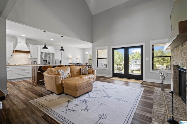 185 Meadowbrook Dr, Piedmont, AL 36272 - living area featuring dark wood-style flooring, a fireplace, baseboards, high vaulted ceiling, and recessed lighting