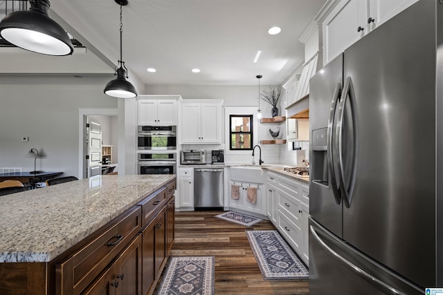 185 Meadowbrook Dr, Piedmont, AL 36272 - kitchen with stainless steel appliances, a sink, dark wood finished floors, white cabinetry, and recessed lighting