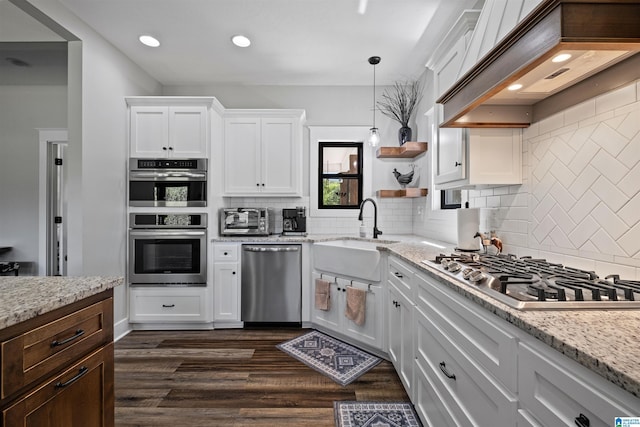 185 Meadowbrook Dr, Piedmont, AL 36272 - kitchen with stainless steel appliances, a sink, white cabinets, backsplash, and recessed lighting