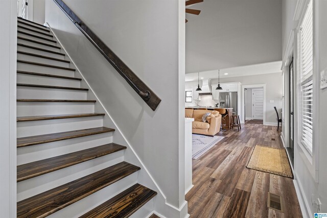 185 Meadowbrook Dr, Piedmont, AL 36272 - stairs with wood finished floors, healthy amount of natural light, baseboards, ceiling fan, and a high ceiling