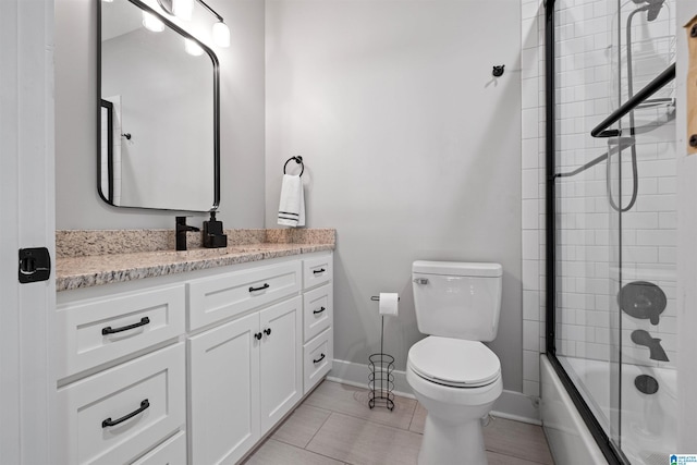 185 Meadowbrook Dr, Piedmont, AL 36272 - bathroom featuring vanity, toilet, bath / shower combo with glass door, baseboards, and tile patterned flooring
