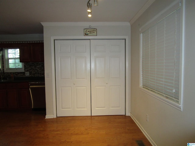 4634 Honeysuckle Rd, Quinton, AL 35130 - unfurnished bedroom featuring crown molding, a sink, wood finished floors, and a closet