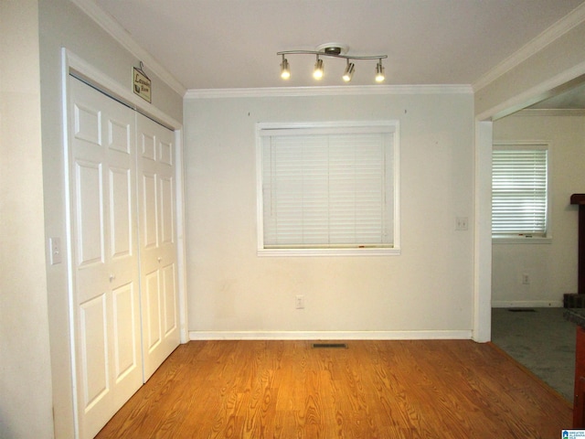 4634 Honeysuckle Rd, Quinton, AL 35130 - unfurnished dining area with wood finished floors, crown molding, and baseboards