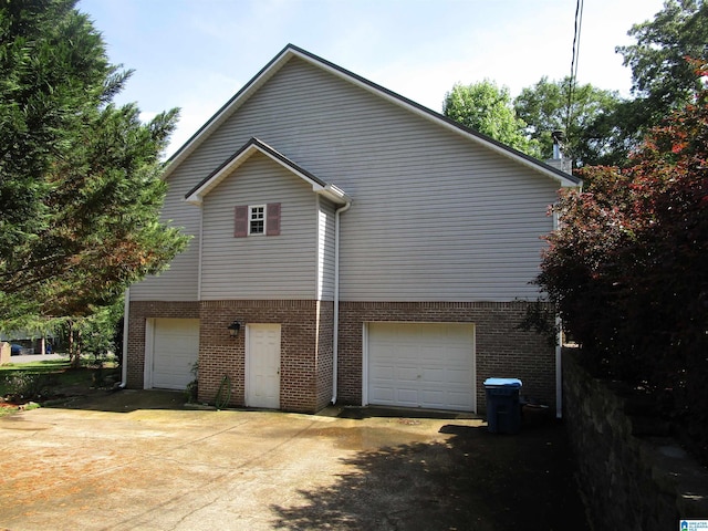 4634 Honeysuckle Rd, Quinton, AL 35130 - view of home's exterior featuring a garage and brick siding