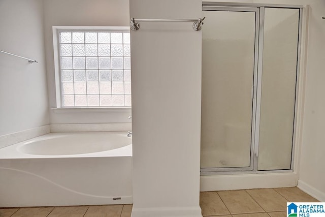 653 Talon Trce, Birmingham, AL 35242 - bathroom featuring a shower stall, tile patterned flooring, and a bath