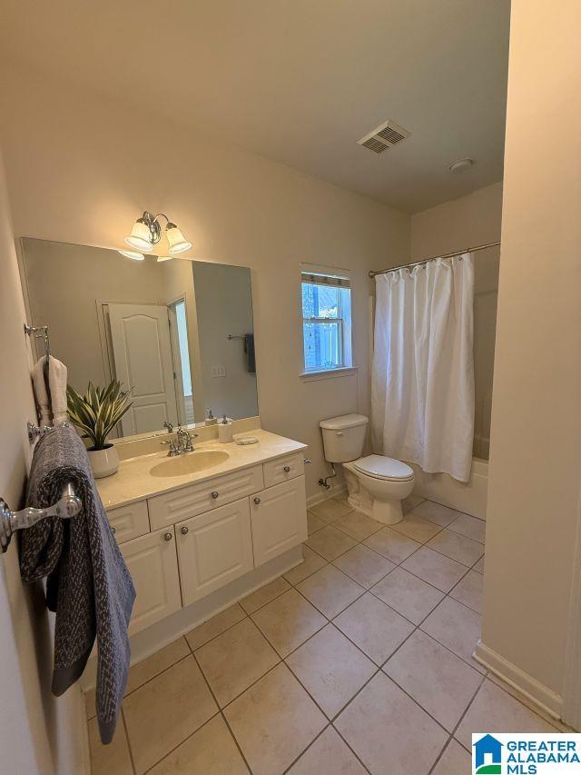653 Talon Trce, Birmingham, AL 35242 - full bathroom with toilet, vanity, tile patterned flooring, shower / tub combo, and baseboards