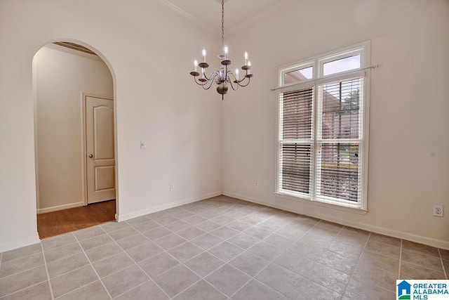 653 Talon Trce, Birmingham, AL 35242 - spare room with arched walkways, light tile patterned floors, crown molding, a chandelier, and baseboards
