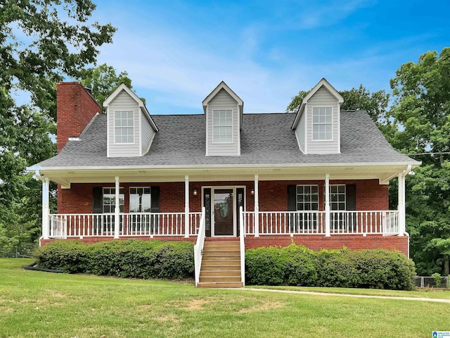 806 14th Ave, Pleasant Grove, AL 35127 - new england style home with brick siding, a chimney, a shingled roof, and covered porch