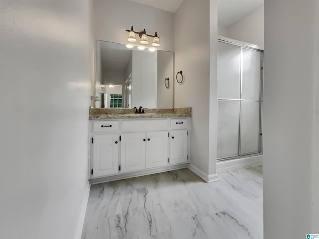 806 14th Ave, Pleasant Grove, AL 35127 - bathroom featuring marble finish floors, a stall shower, vanity, and baseboards