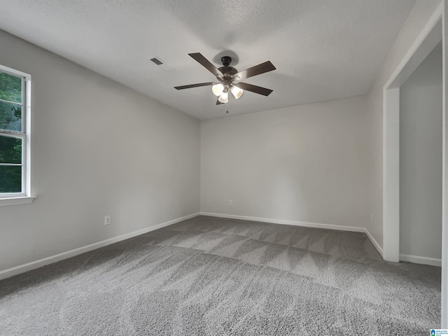 806 14th Ave, Pleasant Grove, AL 35127 - empty room featuring a ceiling fan, carpet flooring, baseboards, and a textured ceiling