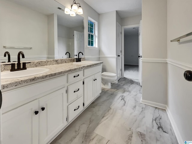 806 14th Ave, Pleasant Grove, AL 35127 - full bathroom with marble look tiles, double vanity, toilet, and baseboards