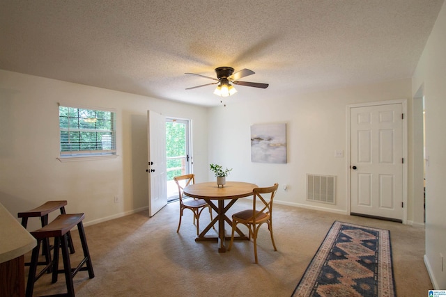 1725 Faircrest Dr, Hueytown, AL 35023 - dining area featuring ceiling fan, baseboards, light carpet, and a textured ceiling
