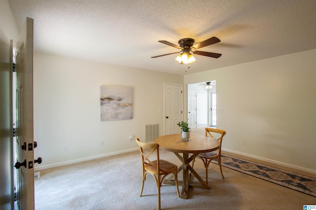 1725 Faircrest Dr, Hueytown, AL 35023 - dining area featuring ceiling fan, light carpet, baseboards, and a textured ceiling