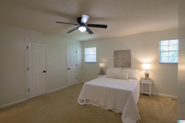 1725 Faircrest Dr, Hueytown, AL 35023 - bedroom featuring light colored carpet, baseboards, and ceiling fan