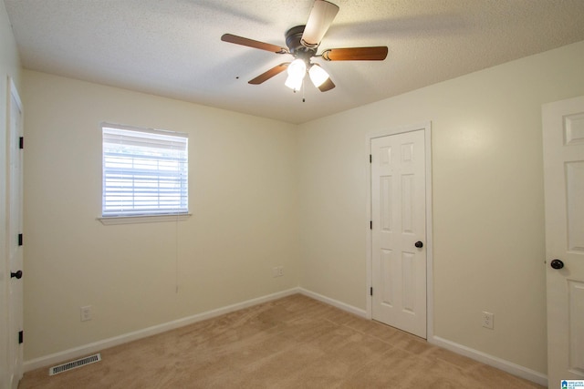 1725 Faircrest Dr, Hueytown, AL 35023 - unfurnished bedroom with light carpet, baseboards, and ceiling fan