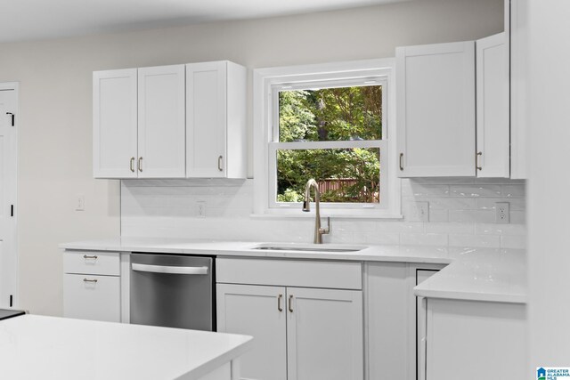 1608 Kestwick Dr, Hoover, AL 35226 - kitchen with dishwasher, a sink, backsplash, and white cabinetry