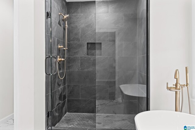 1608 Kestwick Dr, Hoover, AL 35226 - bathroom featuring marble finish flooring, a stall shower, baseboards, and a freestanding tub