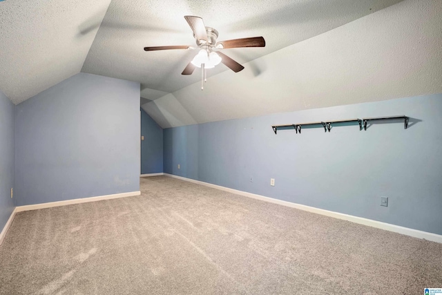 295 Walden Ct, Montevallo, AL 35115 - additional living space featuring carpet, lofted ceiling, a textured ceiling, baseboards, and ceiling fan