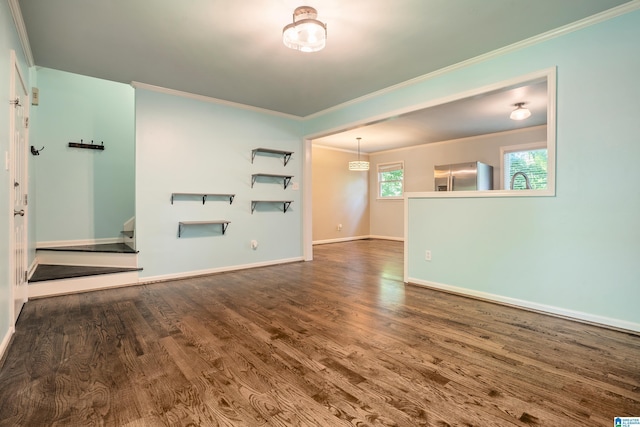 295 Walden Ct, Montevallo, AL 35115 - unfurnished living room featuring crown molding, wood finished floors, and baseboards