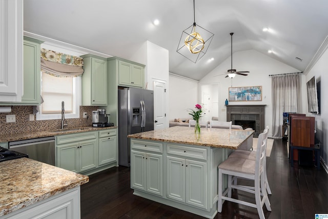3701 James Hill Ter, Hoover, AL 35226 - kitchen featuring green cabinetry, stainless steel appliances, a fireplace, a sink, and a ceiling fan