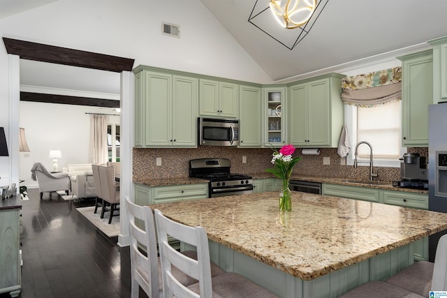 3701 James Hill Ter, Hoover, AL 35226 - kitchen featuring green cabinetry, appliances with stainless steel finishes, a sink, a kitchen breakfast bar, and light stone counters