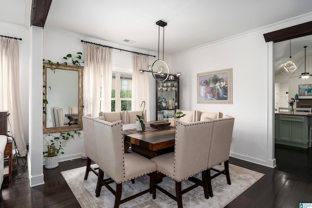 3701 James Hill Ter, Hoover, AL 35226 - dining space with baseboards, crown molding, a chandelier, and dark wood-type flooring
