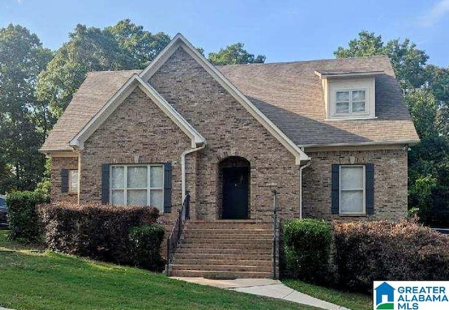 219 Mountain Lake Trl, Alabaster, AL 35007 - view of front facade with brick siding and a front lawn