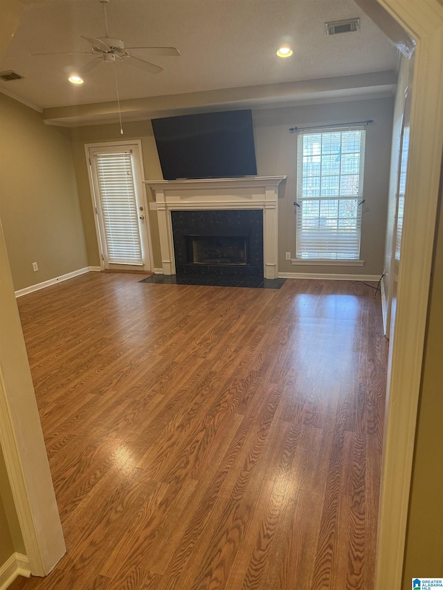 18470 Whispering Meadows Blvd, Vance, AL 35490 - unfurnished living room featuring a premium fireplace, ceiling fan, wood finished floors, recessed lighting, and baseboards