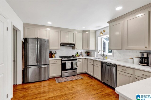 113 Pine Cliff Cir, Hoover, AL 35226 - kitchen featuring appliances with stainless steel finishes, a sink, light countertops, tasteful backsplash, and recessed lighting