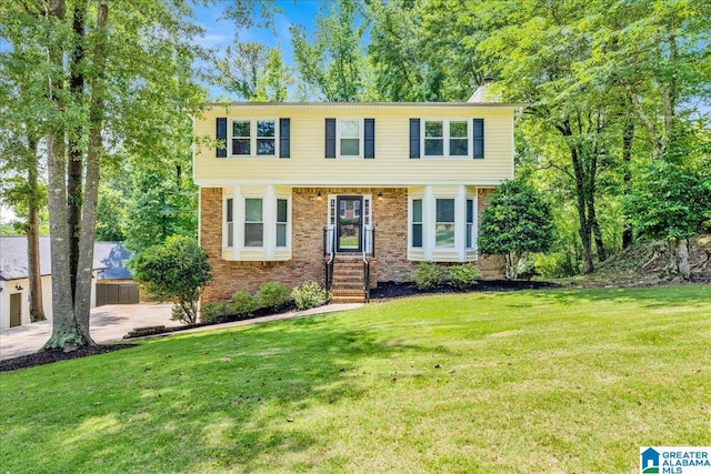 113 Pine Cliff Cir, Hoover, AL 35226 - colonial home featuring a front lawn, brick siding, a chimney, and entry steps