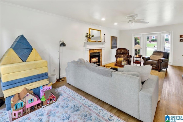 113 Pine Cliff Cir, Hoover, AL 35226 - living room with a ceiling fan, a lit fireplace, wood finished floors, crown molding, and recessed lighting